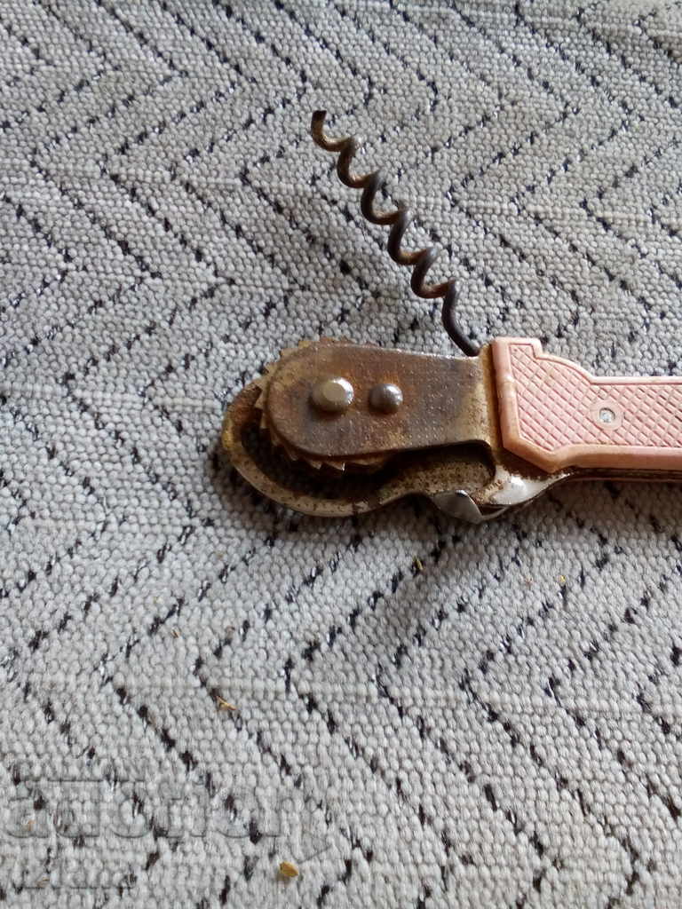 Auction  An old bottle opener