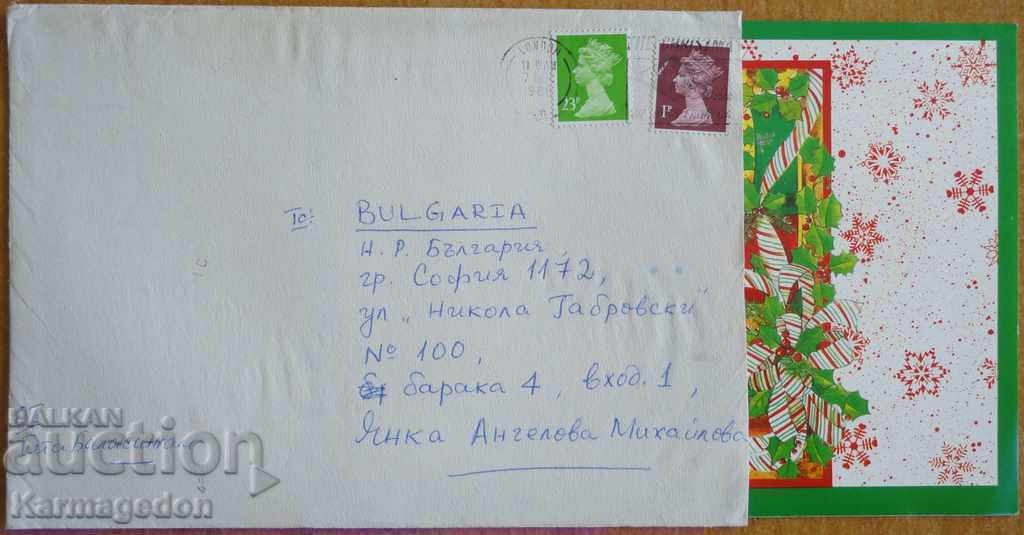 Traveled postcard envelope from England, 1980s