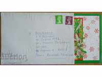 Traveled postcard envelope from England, 1980s