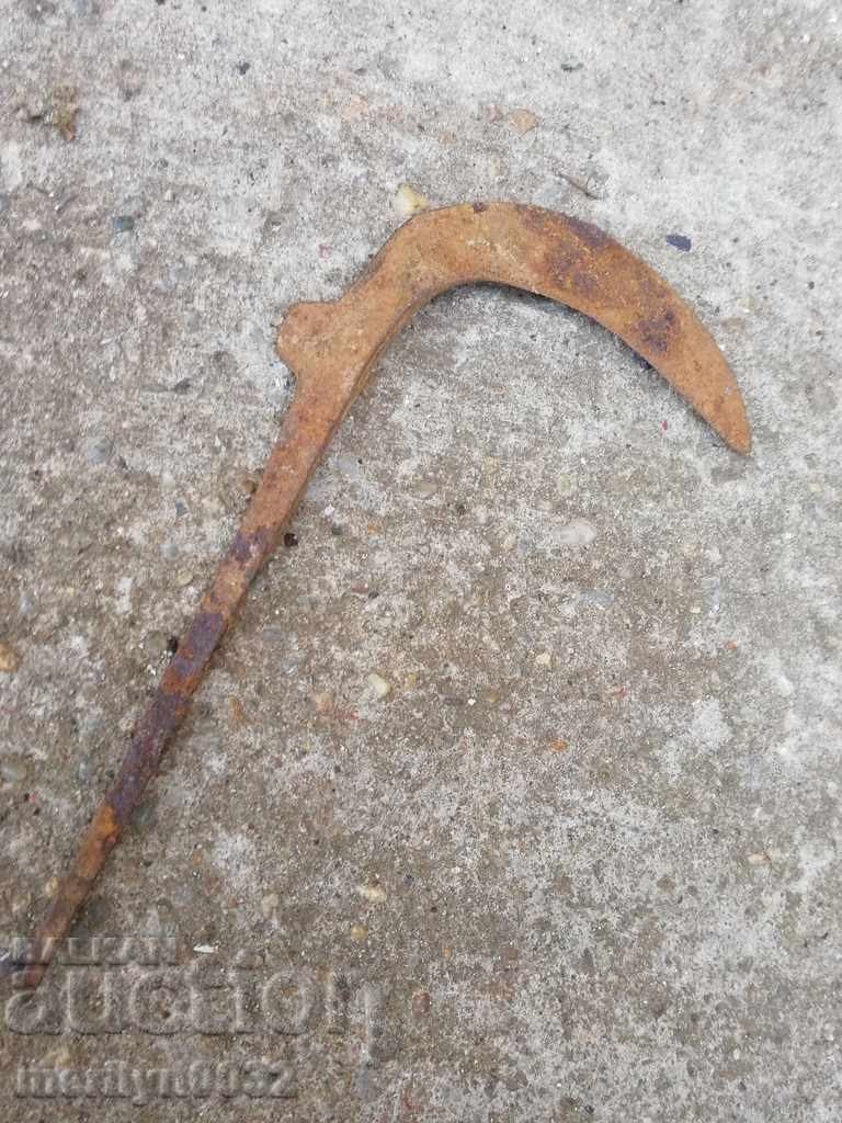 Old handmade hammer, wrought iron mignon