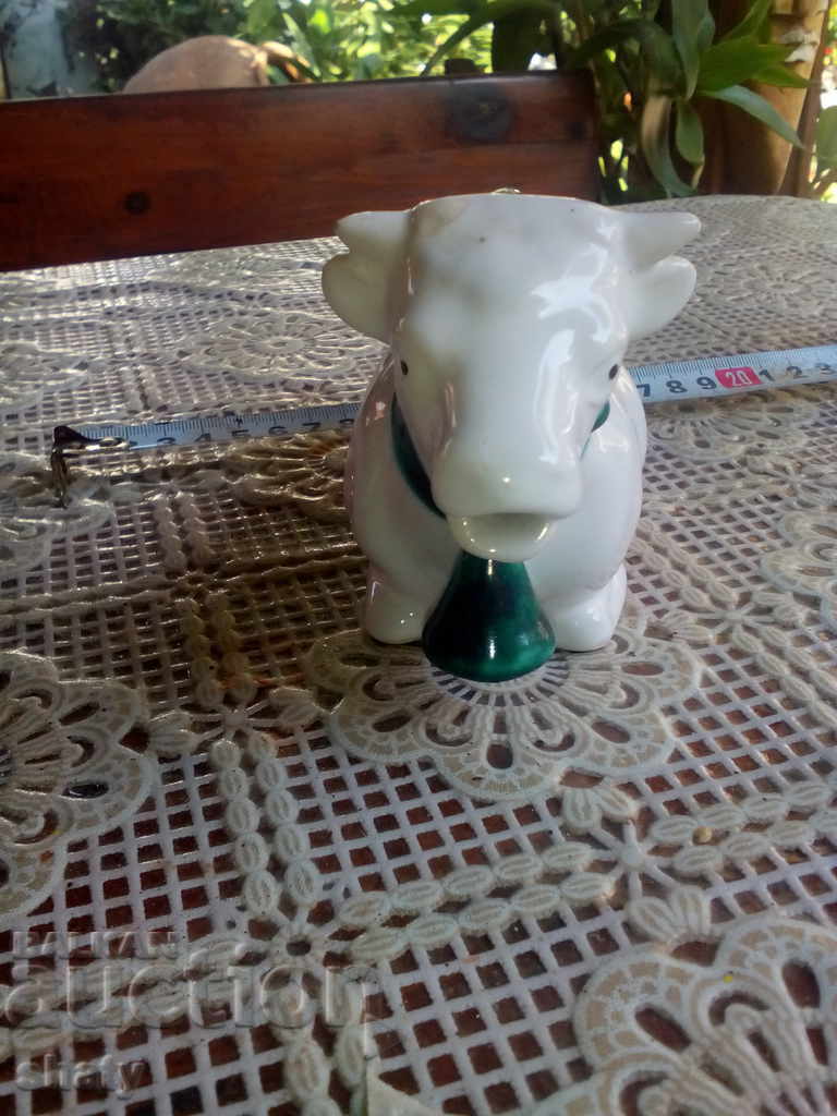 Auction  An old porcelain jug for cream or milk.