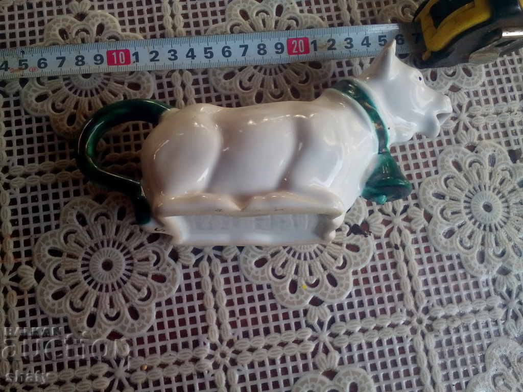 Delivery of An old porcelain jug for cream or milk.