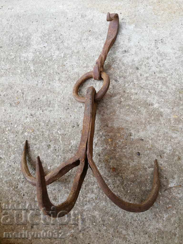 Old forged hook, quail, anchored iron