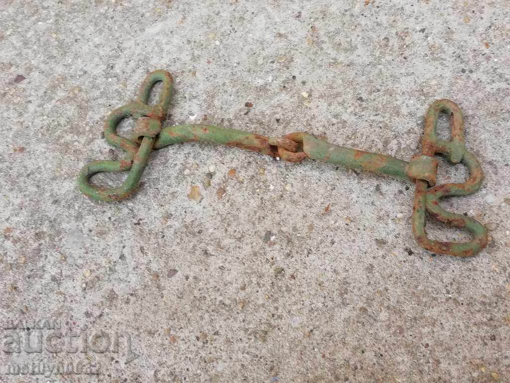 An old forged bridle reins wrought iron, a harness