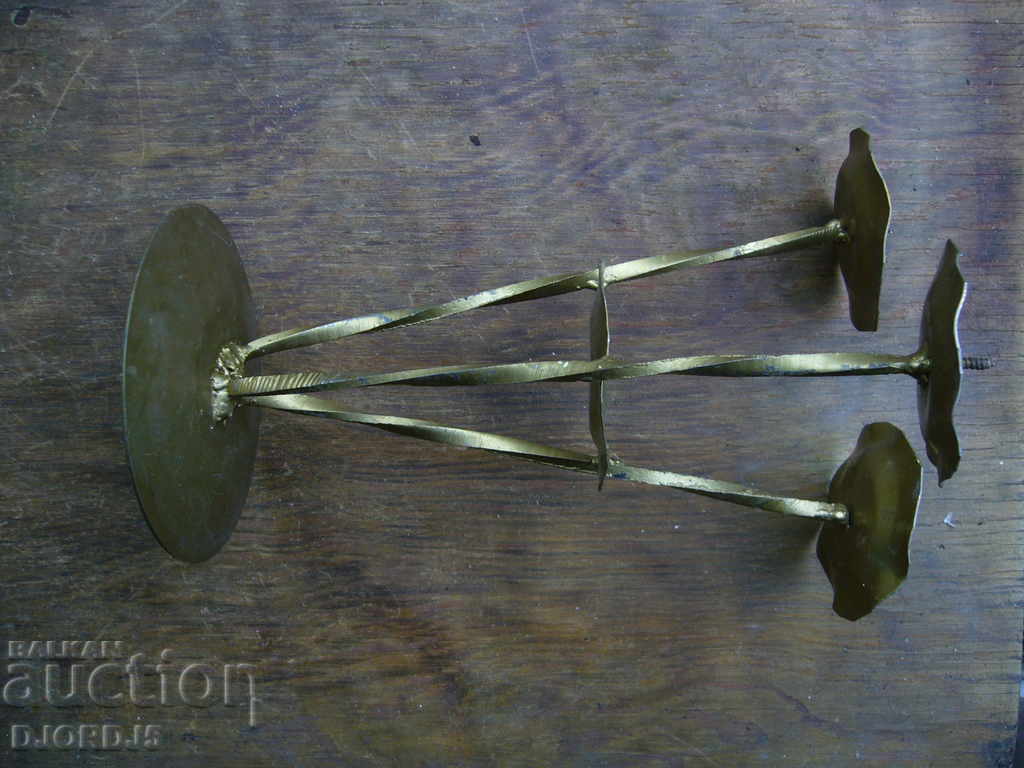 Auction An old metal candleholder Auction An old metal candleholder