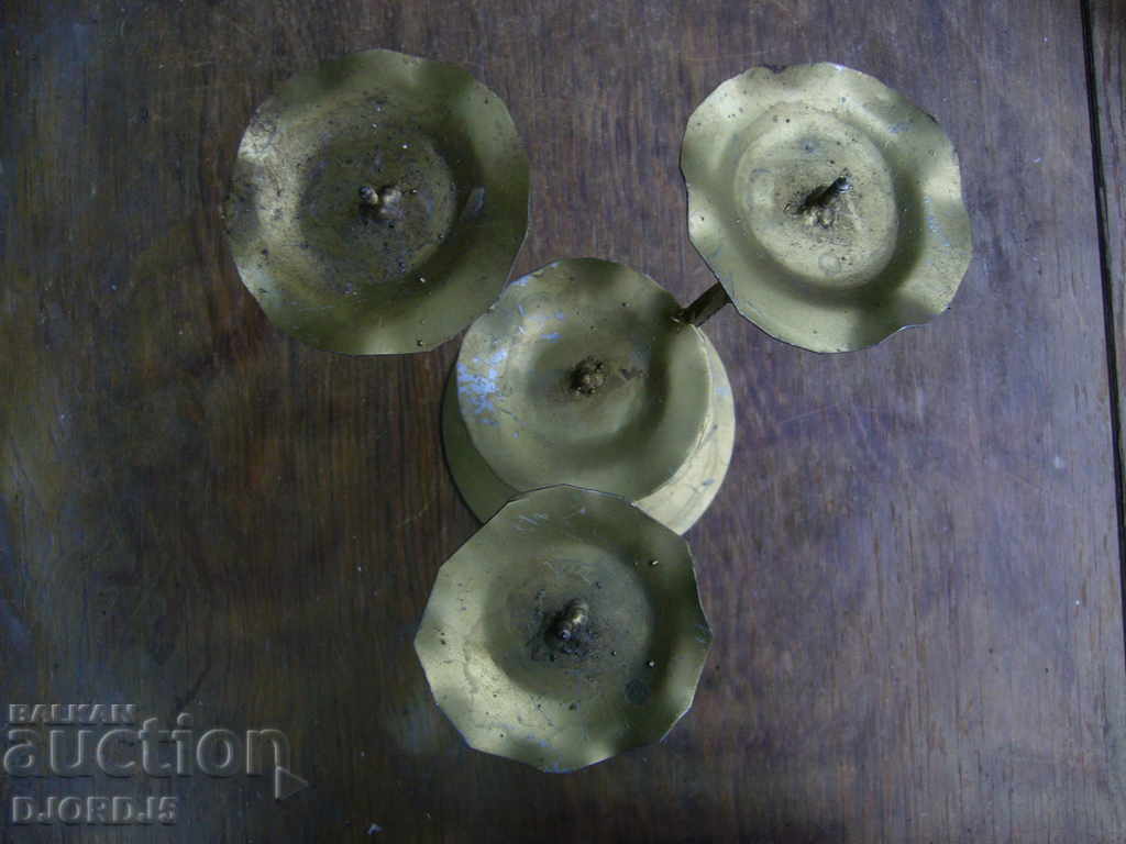 Delivery of An old metal candleholder Delivery of An old metal candleholder