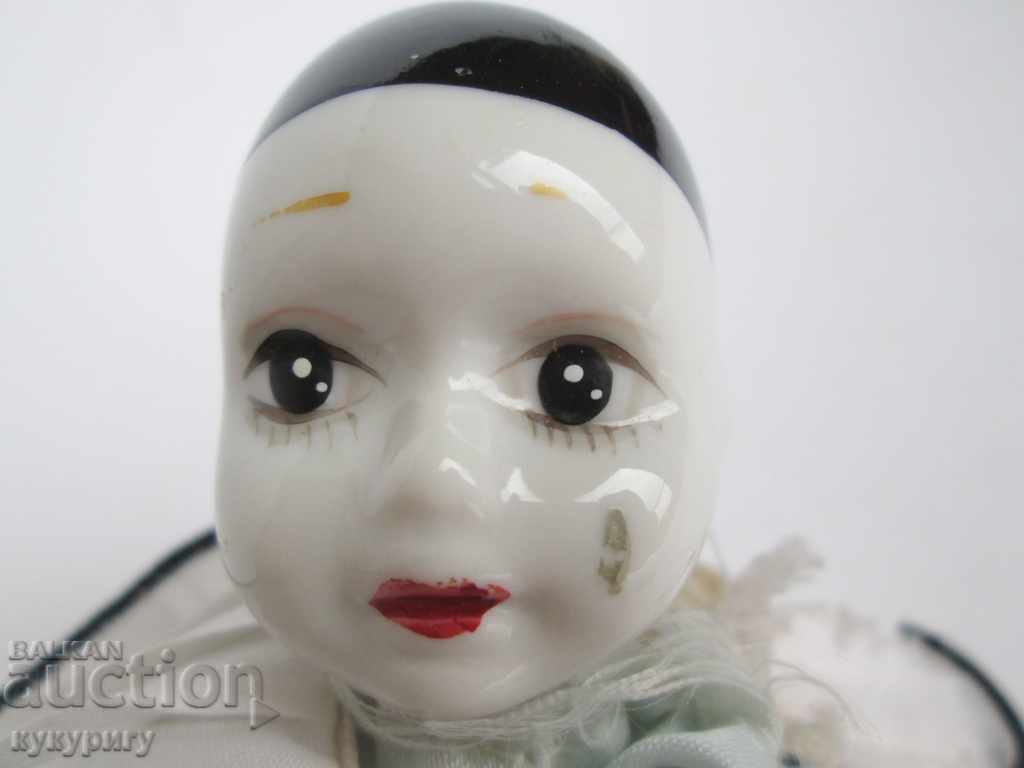 Delivery of A little old doll baby Harlequin painted porcelain