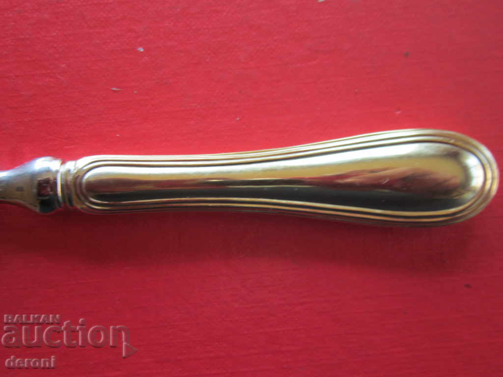 Auction  Unique bronze gilded opener marking crown