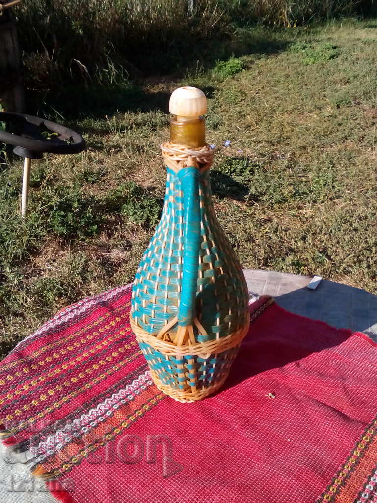 Delivery of An old knitted bottle, a damagan Delivery of An old knitted bottle, a damagan
