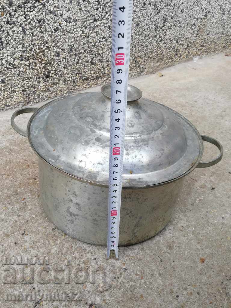 Delivery of An old bakery saucepan, a baker, a brass copper pot Delivery of An old bakery saucepan, a baker, a brass copper pot