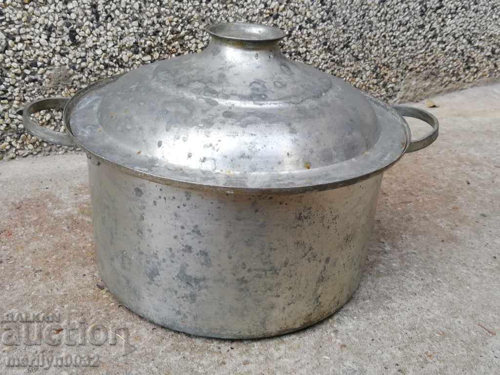 An old bakery saucepan, a baker, a brass copper pot