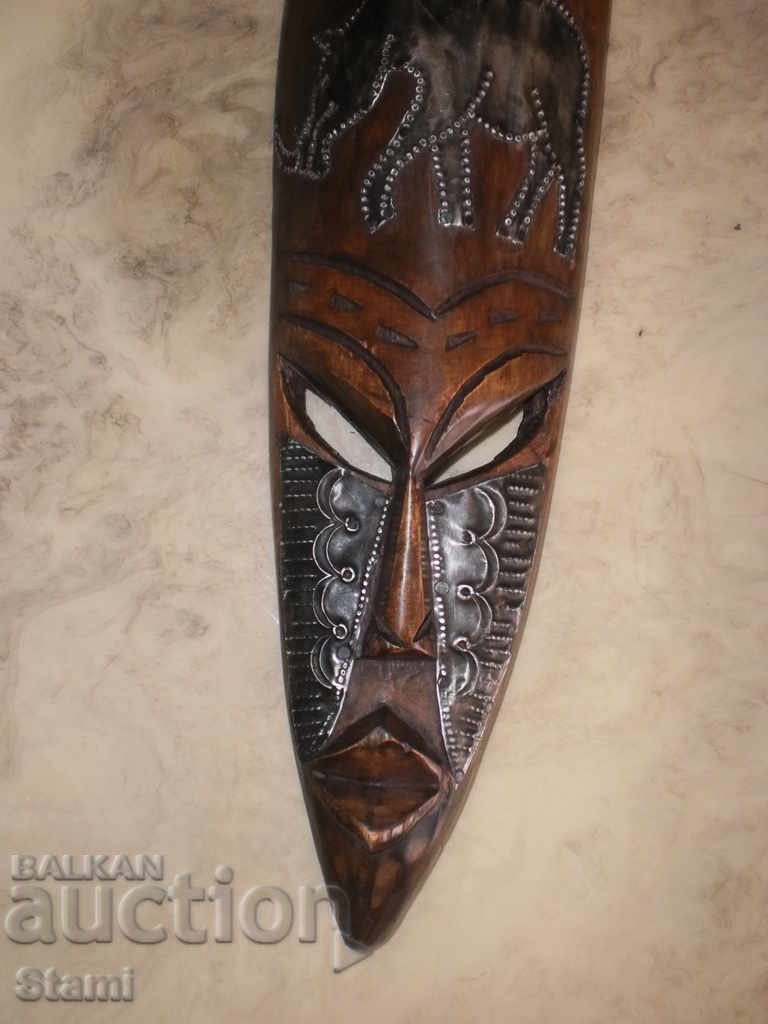 A large African mask made of ebony and copper-12 + - 5 A large African mask made of ebony and copper-12 + - 5