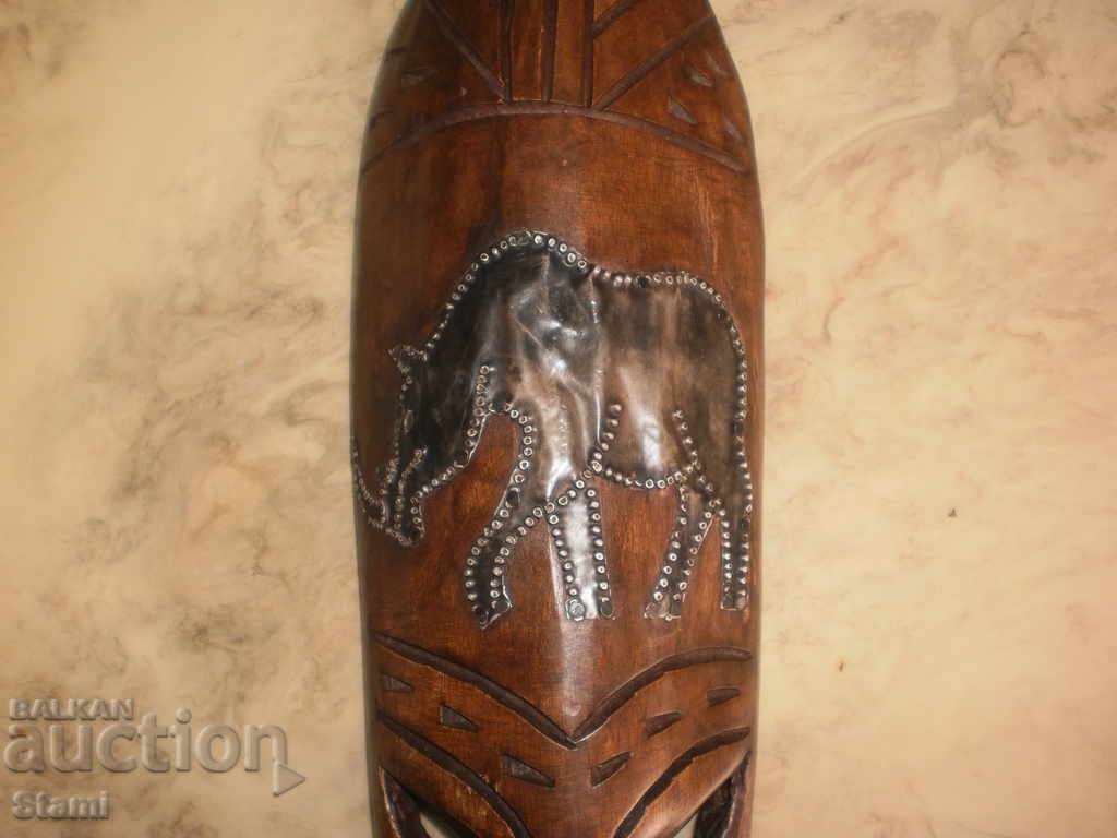 A large African mask made of ebony and copper-12 + - 6 A large African mask made of ebony and copper-12 + - 6