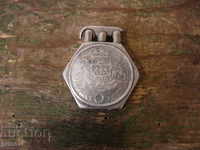 An antique silver lighter