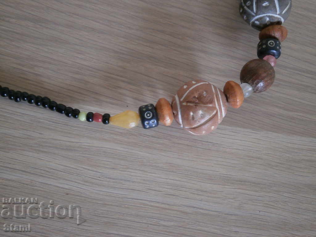 Auction Necklace with African motifs in grunge style-5 Auction Necklace with African motifs in grunge style-5