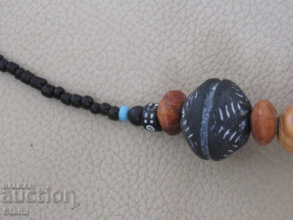Auction Necklace with African motifs in grunge style-9 Auction Necklace with African motifs in grunge style-9