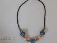 Necklace with African motifs in grunge style-9