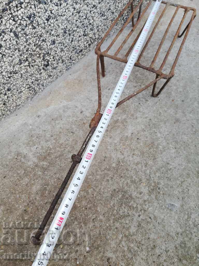 Delivery of An old hand-forged grill, a steak, wrought iron Delivery of An old hand-forged grill, a steak, wrought iron