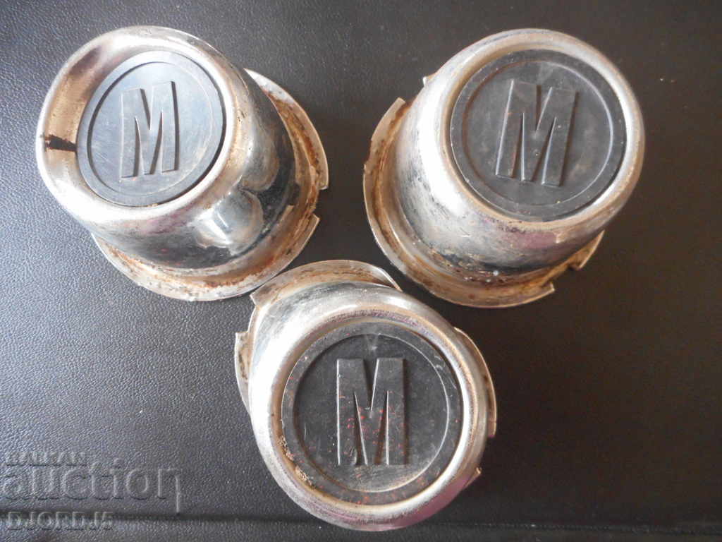 Old caps, emblems from Moskvich car