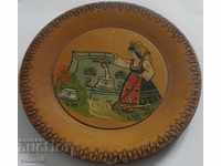 a small old wooden wall plate