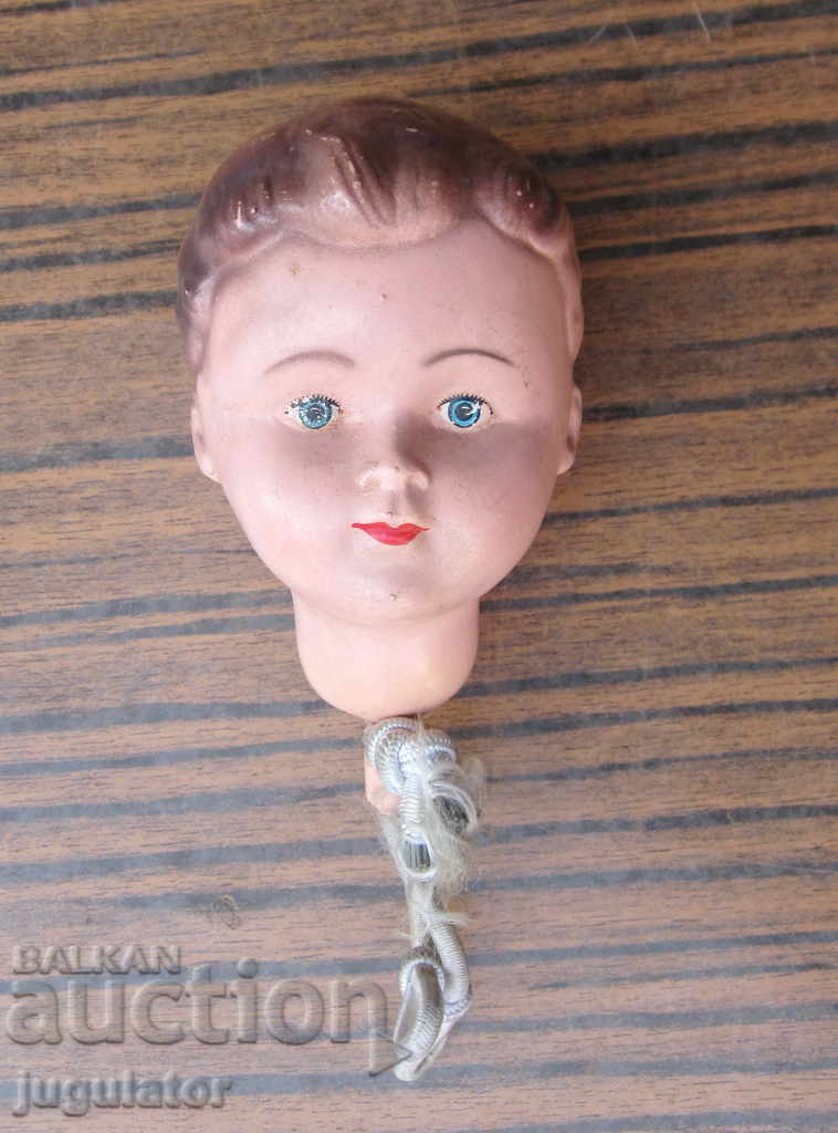 an old celluloid head for an ancient Art Deco German doll