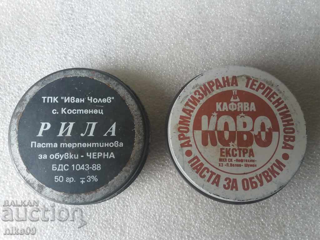 Old soc tin cans of shoe polish.