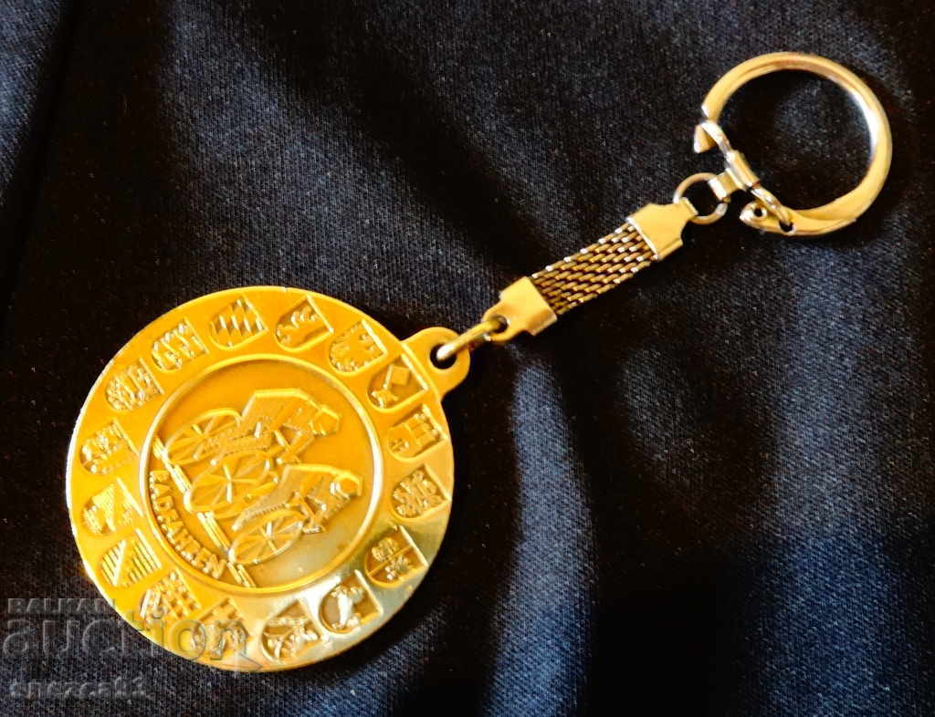 Brass keychain with coat of arms.