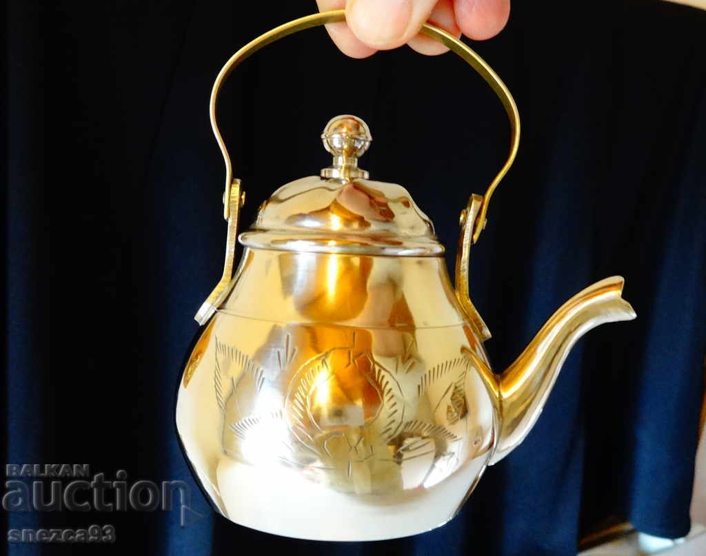 Ancient bronze teapot, jug.