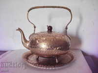 Old brass teapot and tray