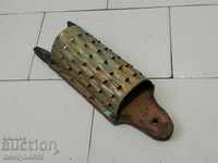 Old grater from the beginning of the twentieth century, primitive