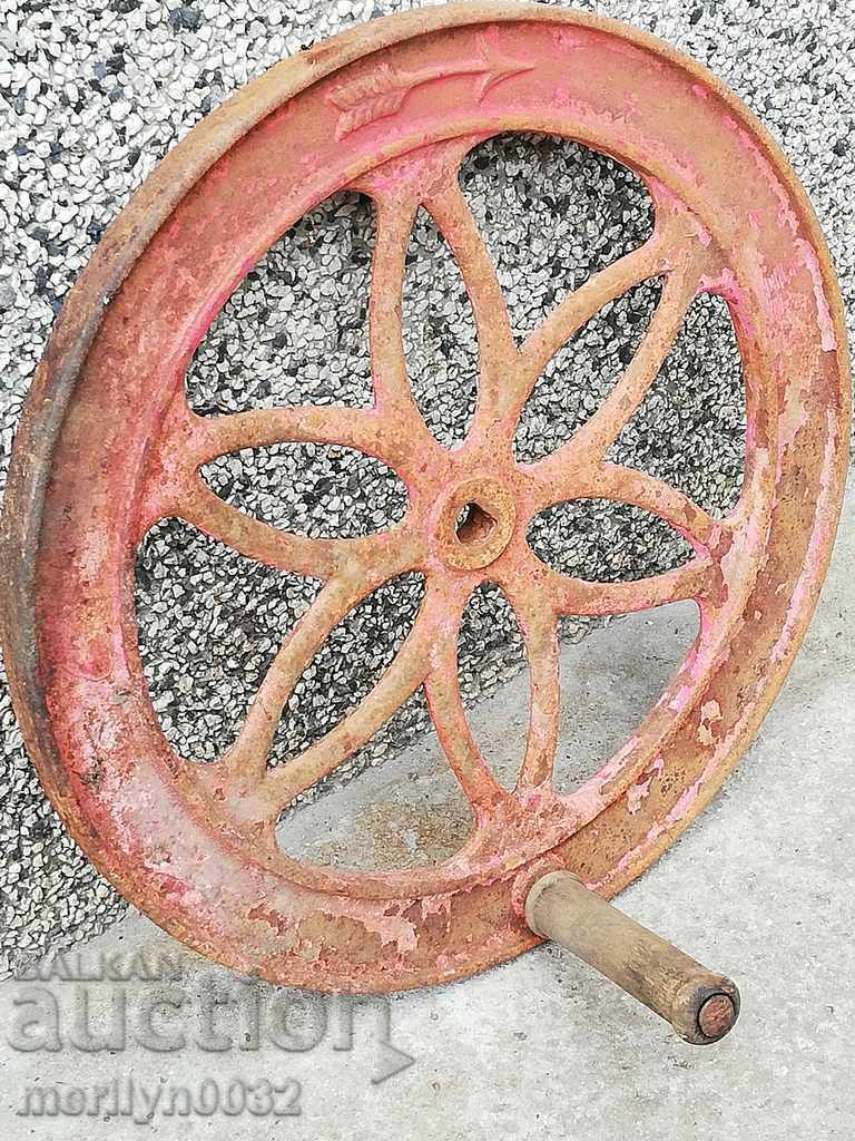 Wrought iron relief cast iron spinning wheel