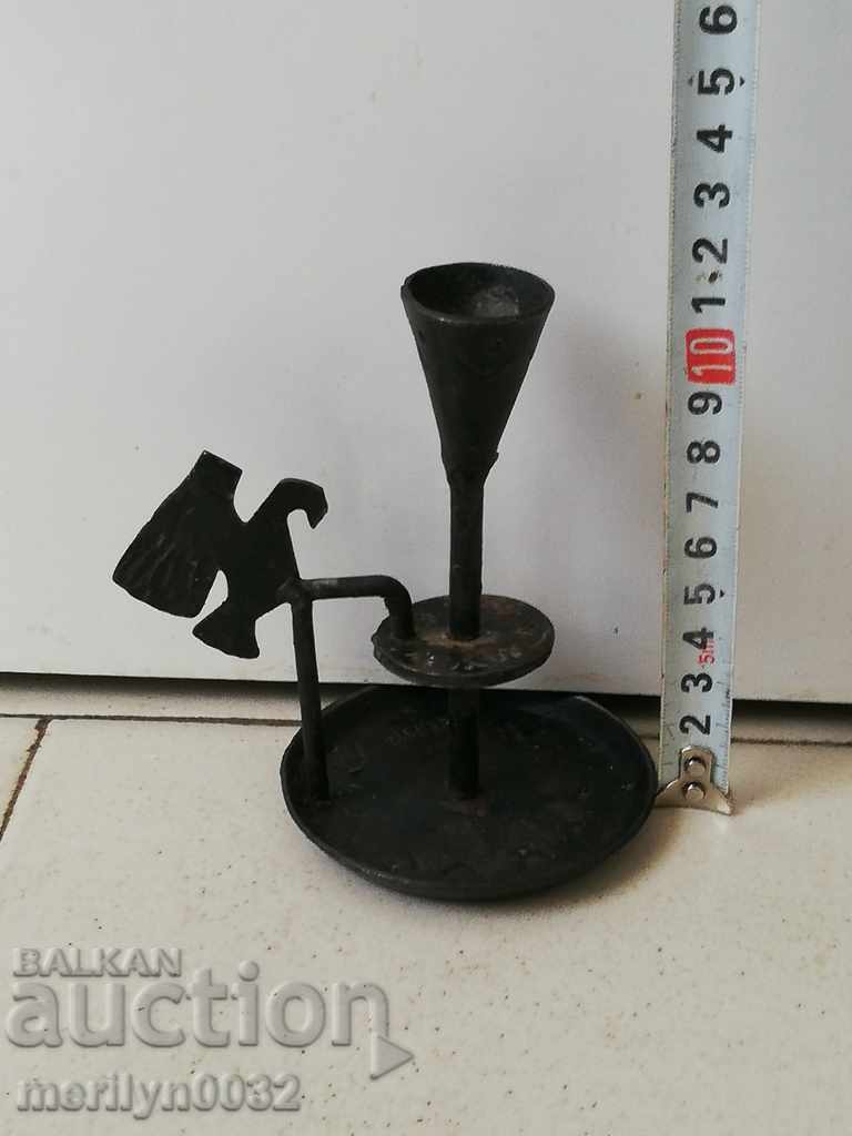 Auction Old forged candlestick, candle, wrought iron candelabra Auction Old forged candlestick, candle, wrought iron candelabra