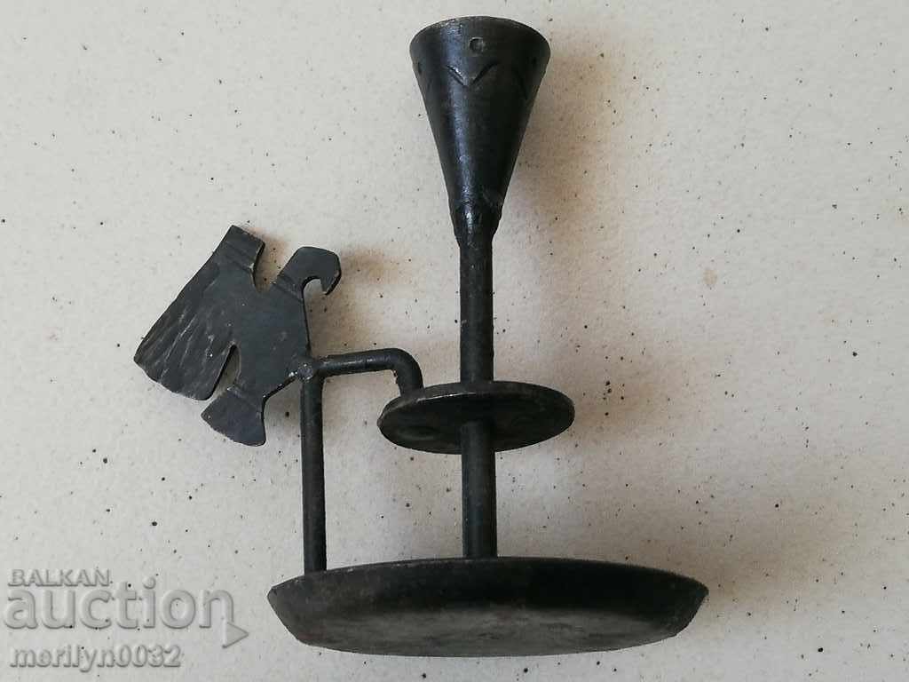 Delivery of Old forged candlestick, candle, wrought iron candelabra Delivery of Old forged candlestick, candle, wrought iron candelabra