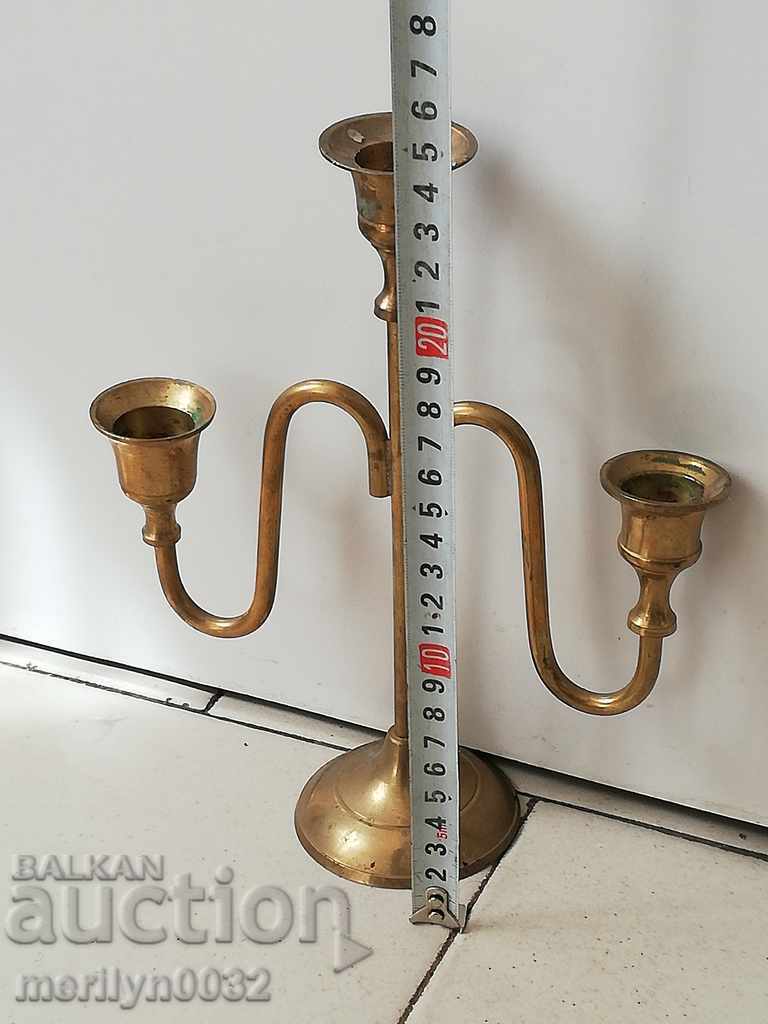 Delivery of An old candle made of brass candle, candelabra