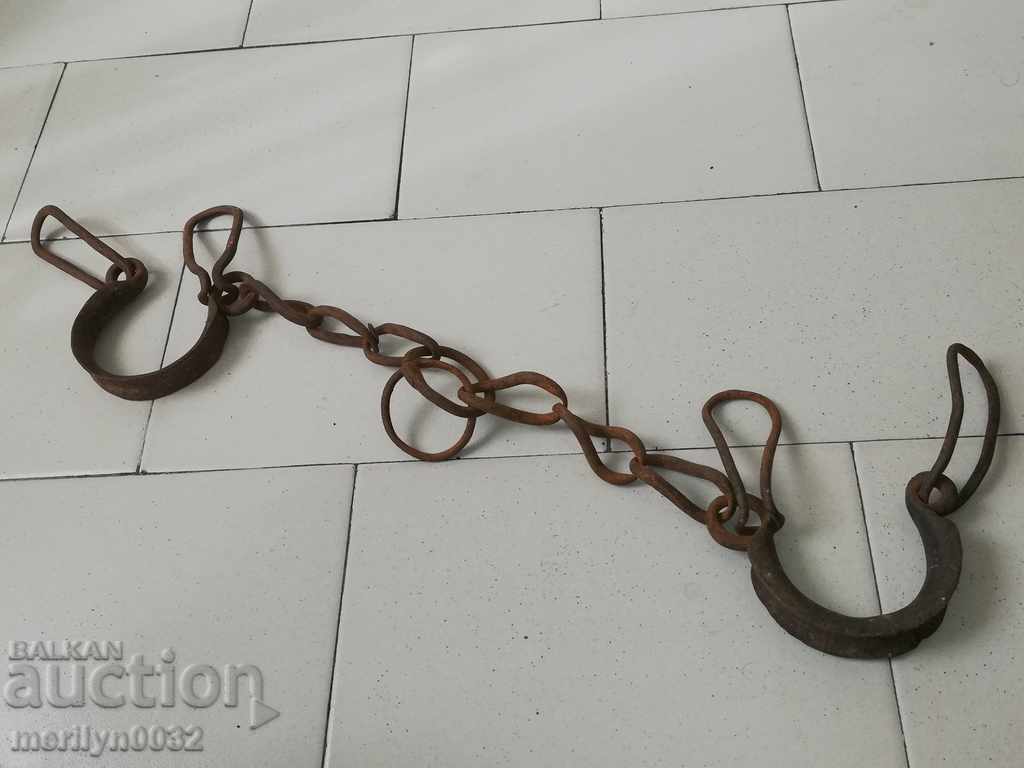 Old hand-forged buckles, chains, shackles, shackles
