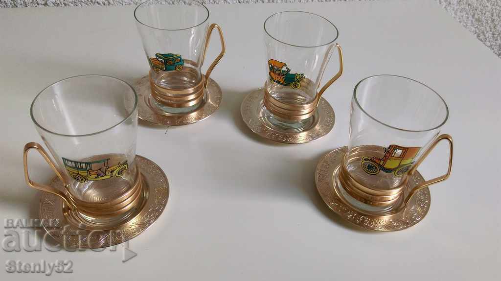 Glasses of yen glass for tea with cup and plates