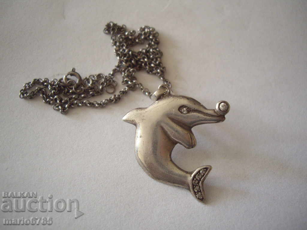Silver rosette with silver dolphin,