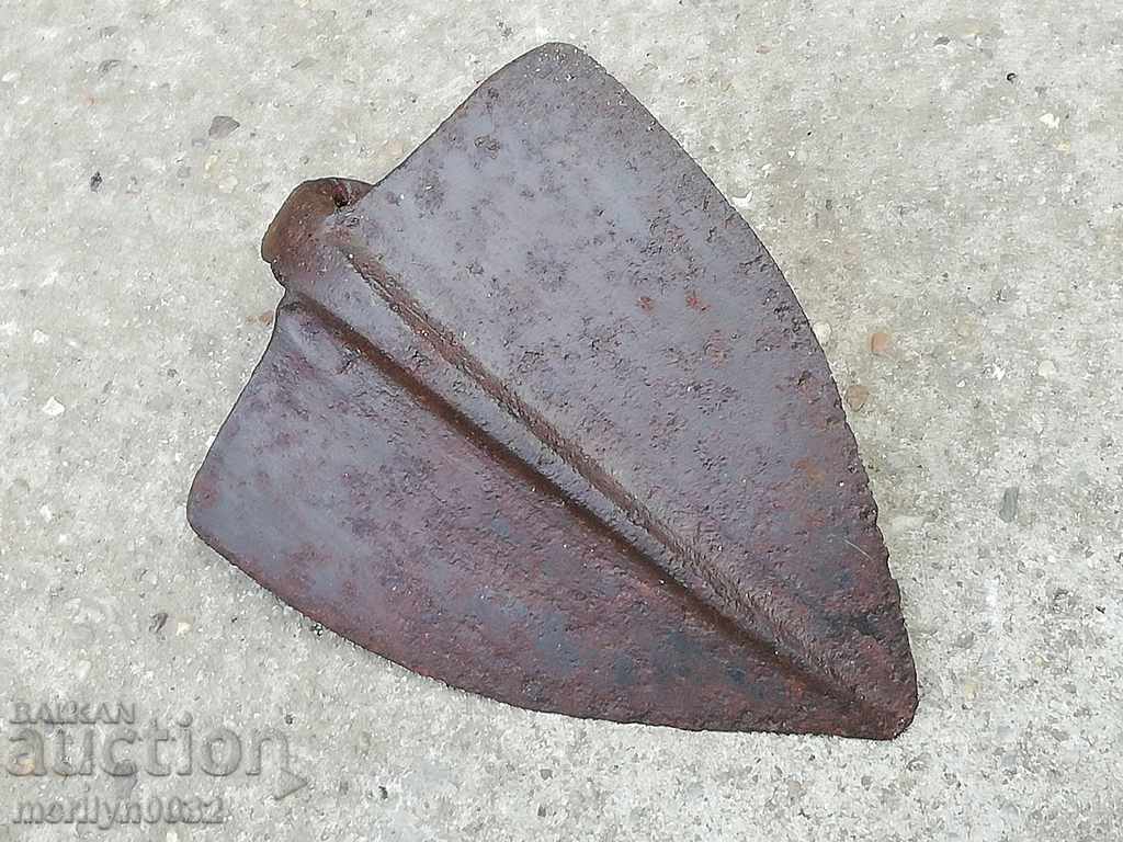 Old chocolate, wrought iron tool