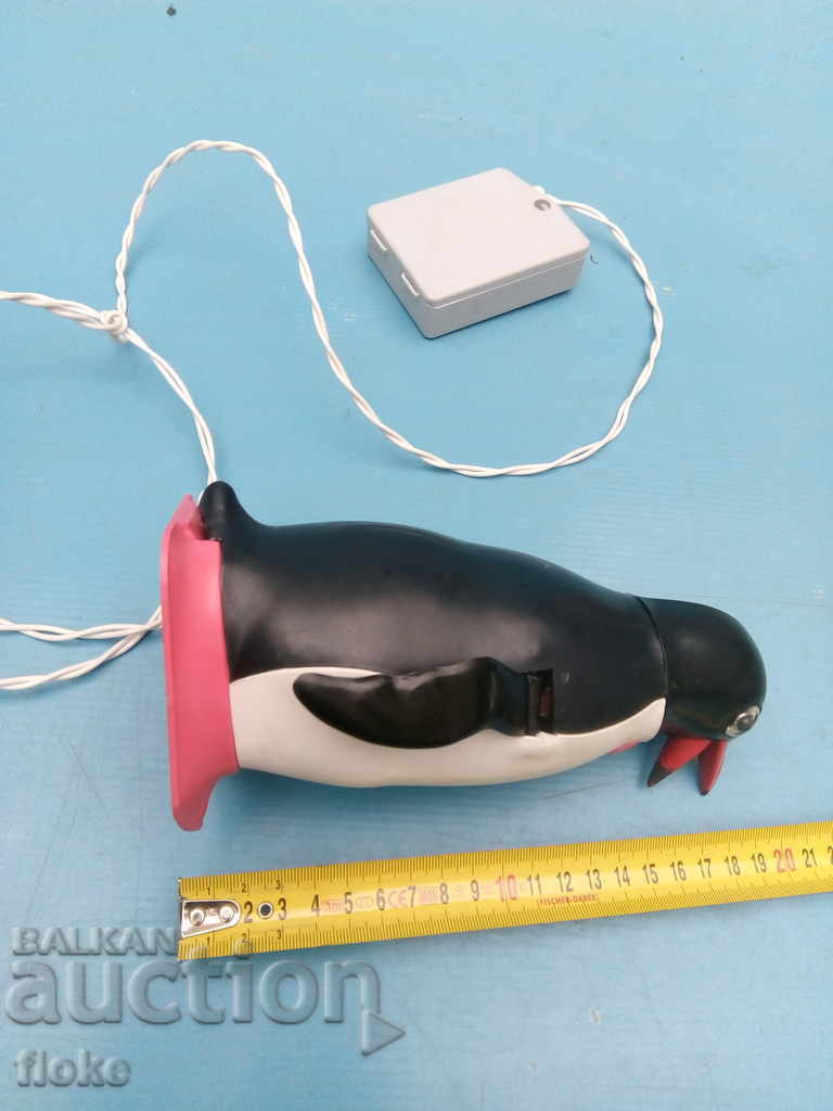 Delivery of An old mechanical toy penguin Delivery of An old mechanical toy penguin