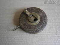 старинен метален метър кожена ролетка