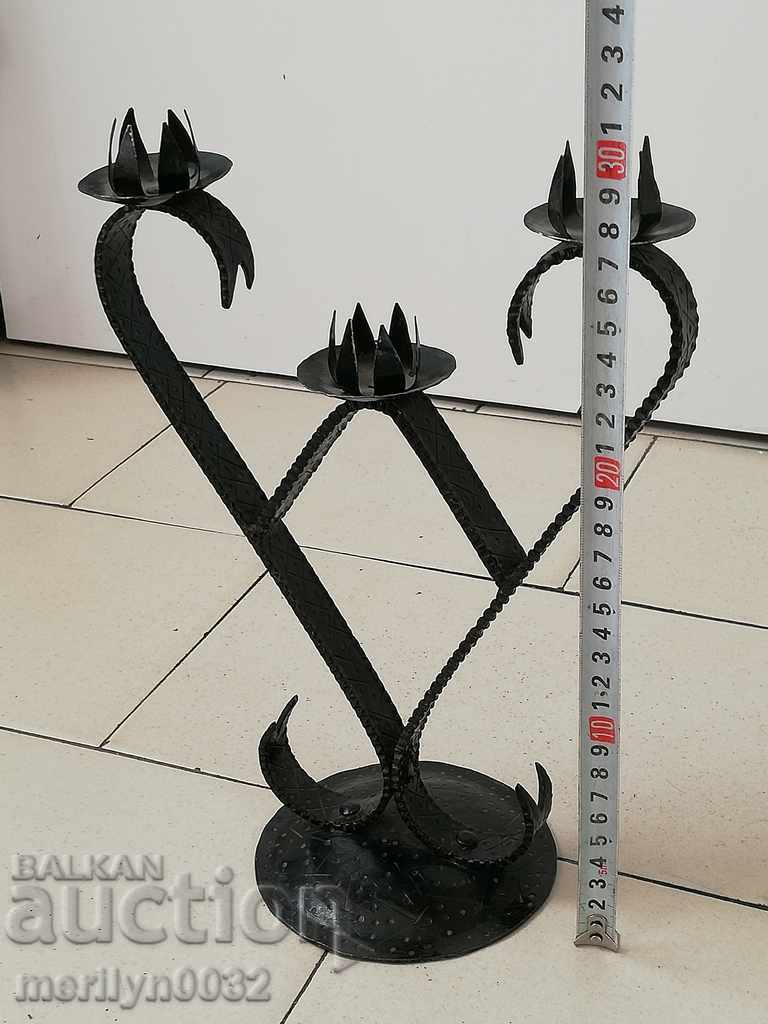 An old forged candlestick from a period period candle
