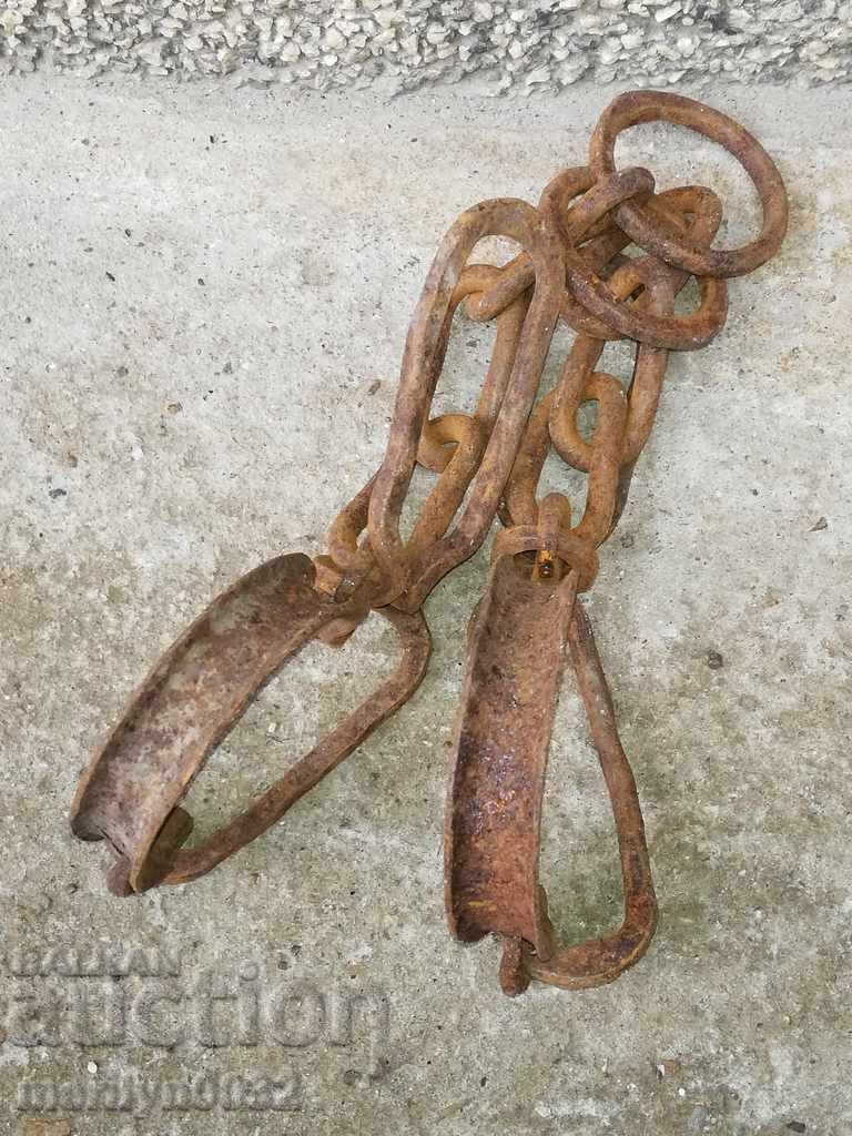 Auction Pair of buckles, shackles, chain, wrought iron Auction Pair of buckles, shackles, chain, wrought iron