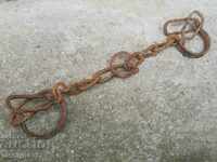 Pair of buckles, shackles, chain, wrought iron