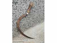 Old forged sickle farm wrought iron tool