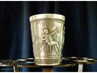 German cup of tin embossed.