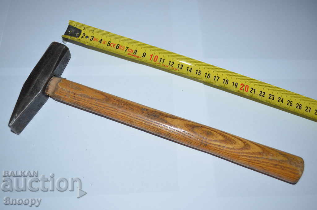 Steel hammer with wooden handle