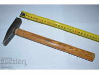 Steel hammer with wooden handle