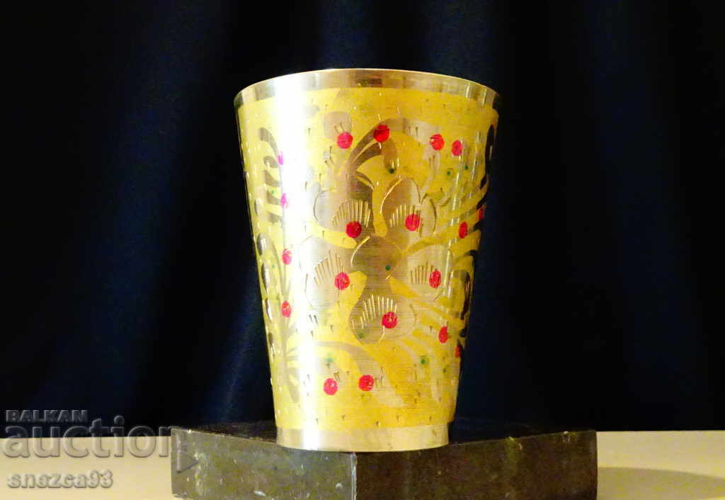 Ancient bronze cup, decorated.