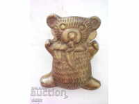 Old bronze clip - bear