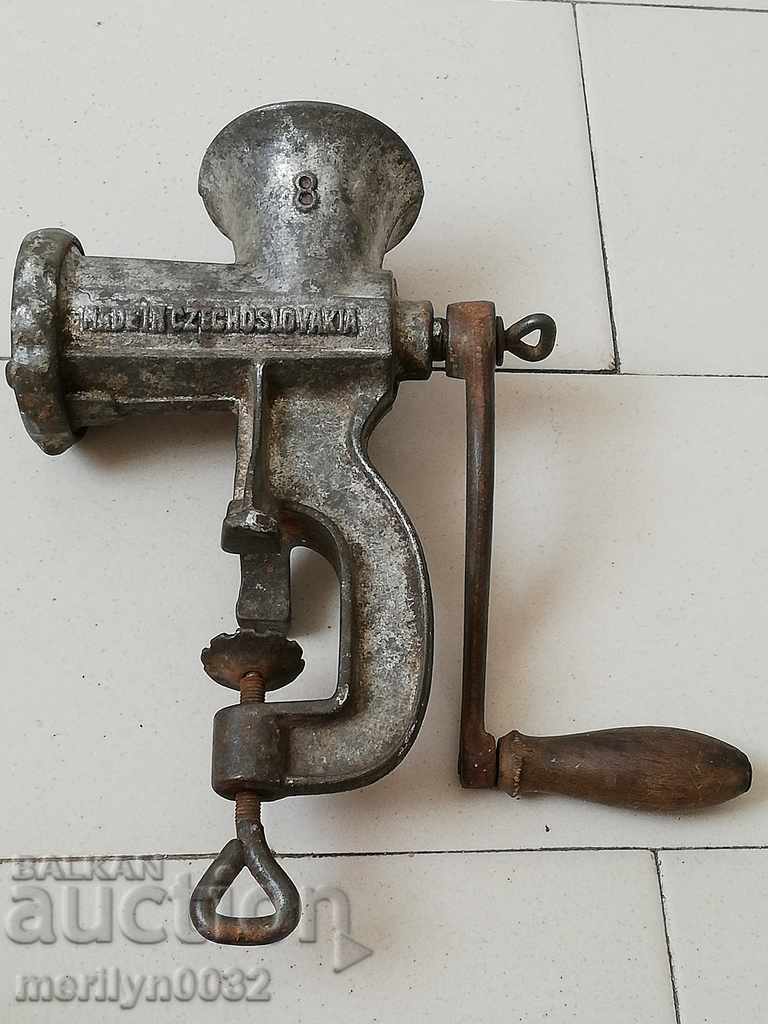 An old meat grinder, a milling machine